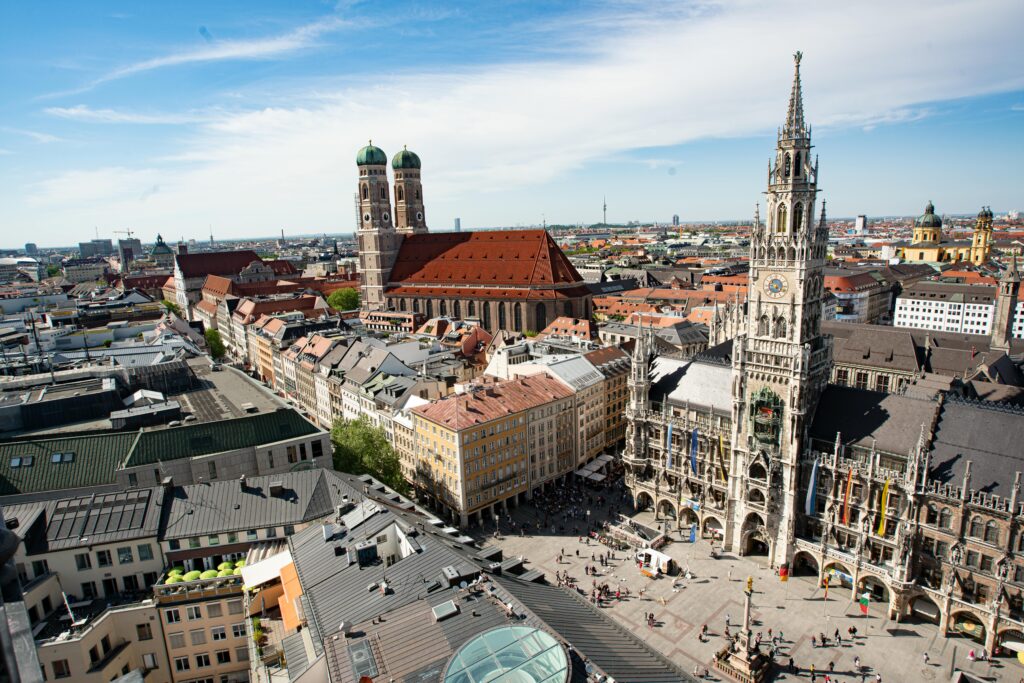 Majestic aerial view of Munich's Marienplatz and Frauenkirche showcasing historic architecture.